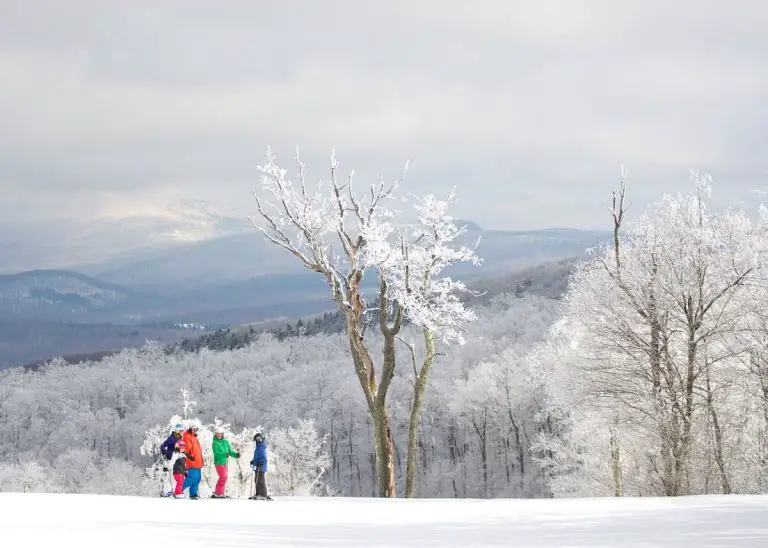 family skiing on Jiminy Peak